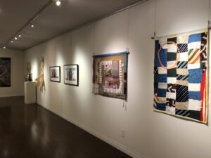 fabric art hanging in gallery